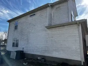 Dirty house siding before soft wash cleaning in Middle Tennessee