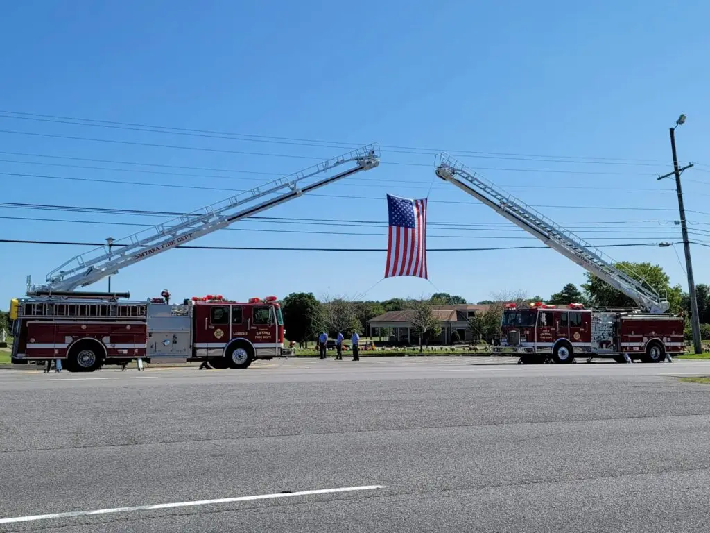 firetrucks with flag