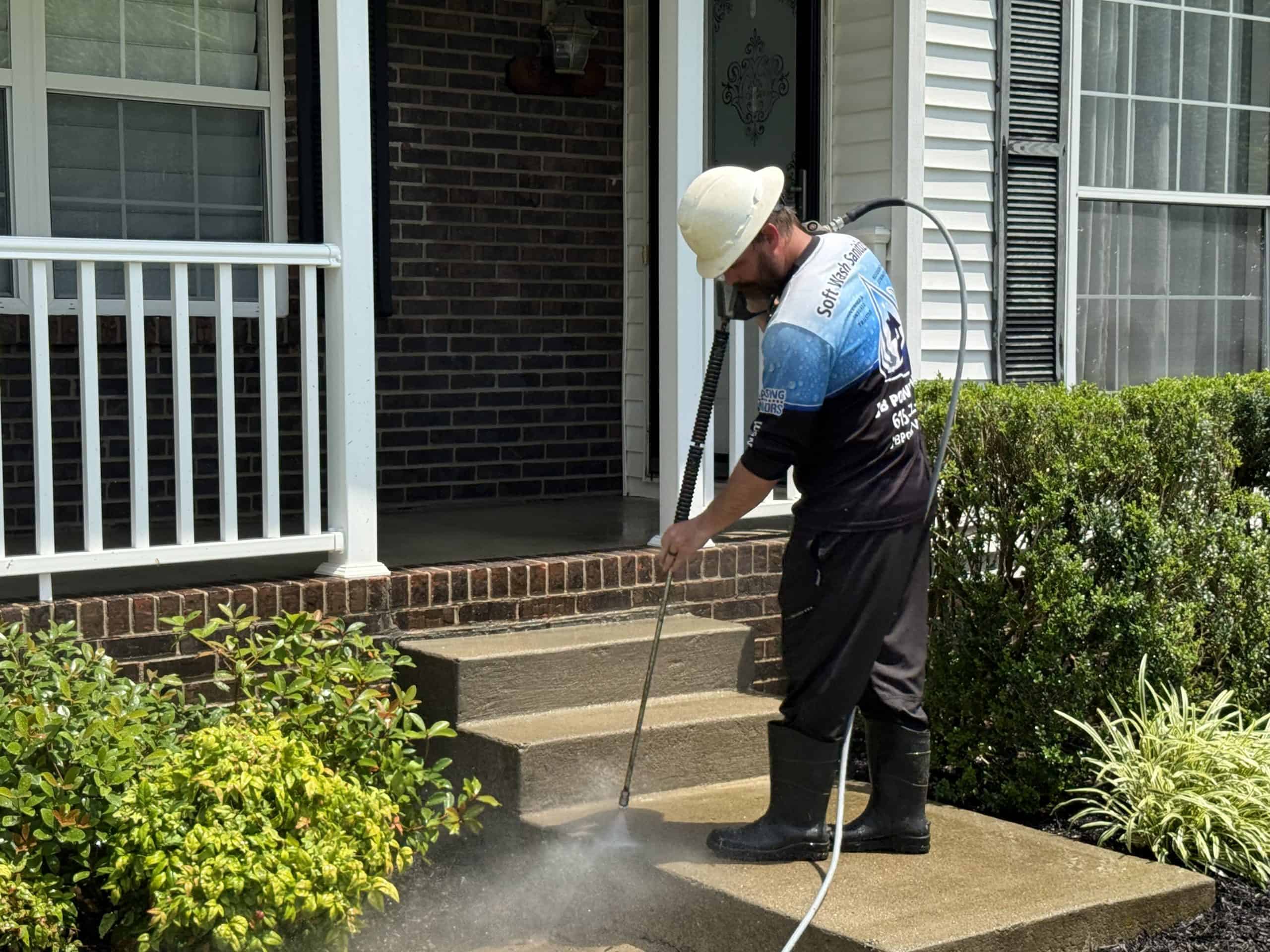 JB Power Wash® technician sidewalk washing