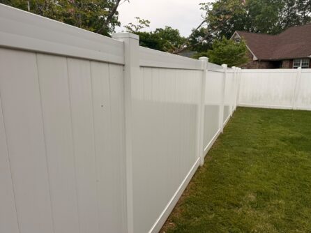 Clean white vinyl privacy fence after pressure washing by JB Power Wash