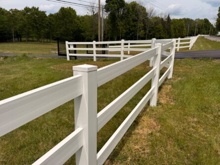 Clean white vinyl ranch fence after pressure washing by JB Power Wash